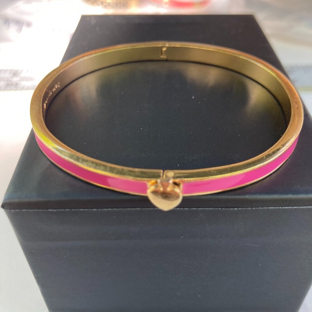 Thin Kate Spade pink and gold clamper bangle bracelet